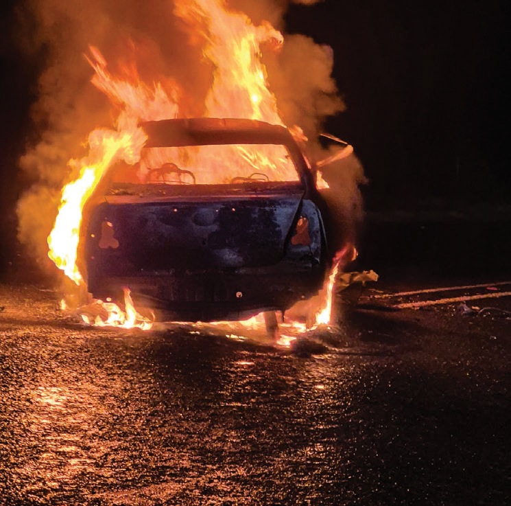The Toyota Etios engulfed in flames following the head-on collision on the R510 near the Crocodile Bridge on 25 September 2026.